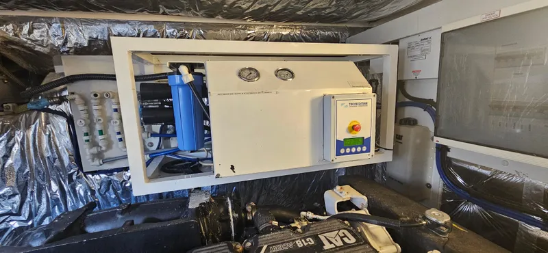  Yacht Photos Pics Engine room of a 2014 Princess 64 yacht with control panel and equipment.