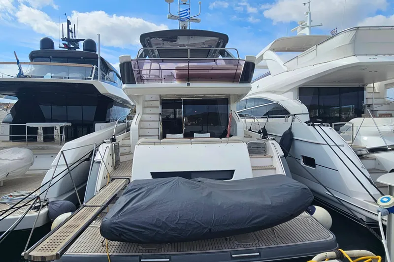  Yacht Photos Pics Luxury Princess 64 yacht from 2014 docked at marina, surrounded by other boats.