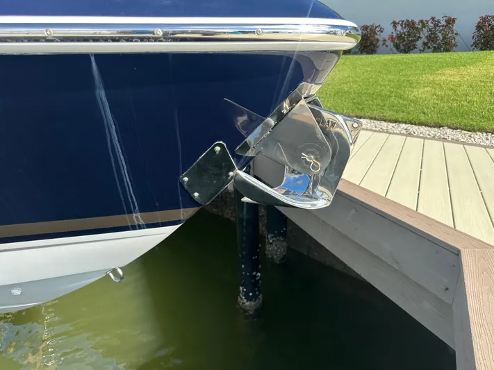  Yacht Photos Pics 2015 Formula 310 Bowrider boat anchored at dockside, close-up view.