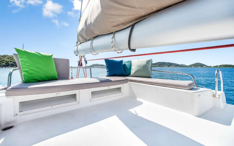 Endless Azul Yacht Photos Pics Luxurious 2013 Fountaine Pajot Sanya 57 yacht with colorful cushions on deck.