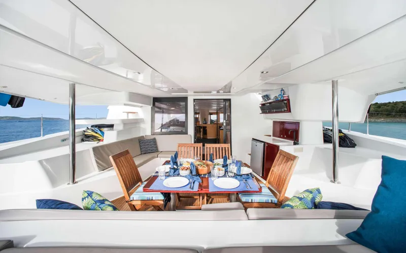 Endless Azul Yacht Photos Pics Luxurious 2013 Fountaine Pajot Sanya 57 yacht with elegant outdoor dining area.