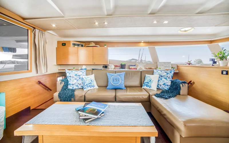 Endless Azul Yacht Photos Pics Luxurious interior of 2013 Fountaine Pajot Sanya 57 yacht with cozy seating and nautical decor.