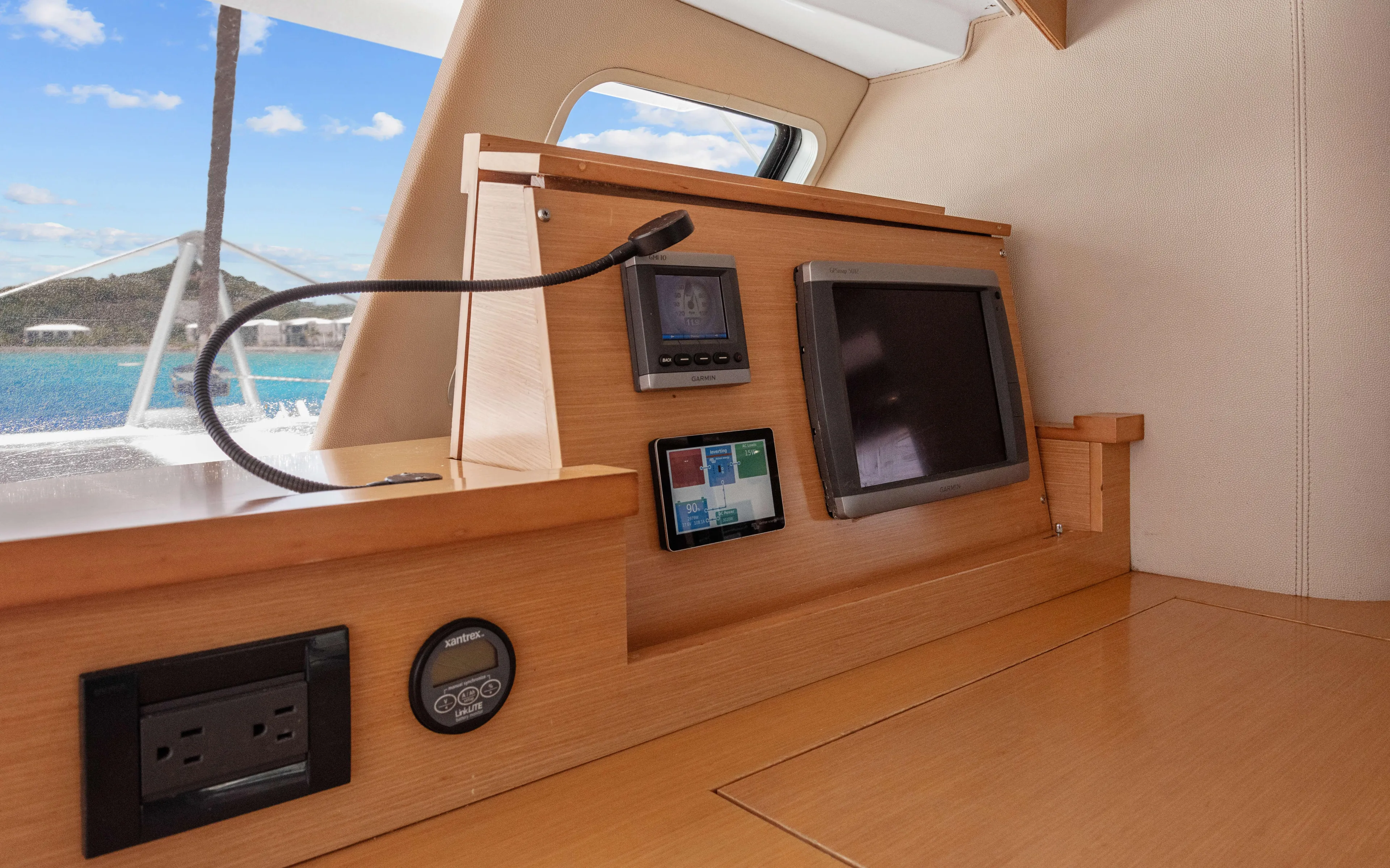Endless Azul Yacht Photos Pics Interior of 2013 Fountaine Pajot Sanya 57 yacht with navigation equipment and ocean view.