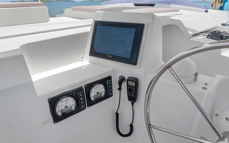 Endless Azul Yacht Photos Pics Helm of 2013 Fountaine Pajot Sanya 57 with navigation equipment and steering wheel.