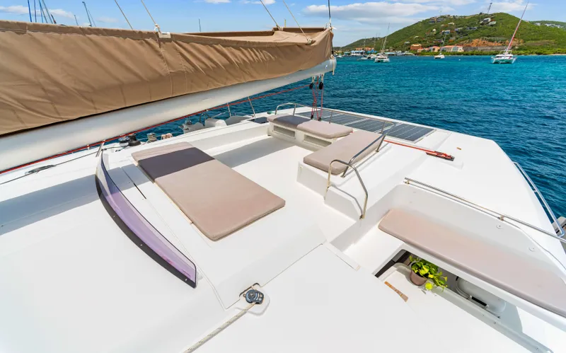 Endless Azul Yacht Photos Pics Luxurious 2013 Fountaine Pajot Sanya 57 yacht deck with sun loungers and scenic ocean view.
