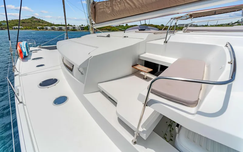 Endless Azul Yacht Photos Pics 2013 Fountaine Pajot Sanya 57 yacht deck with seating, ocean view, and clear sky.