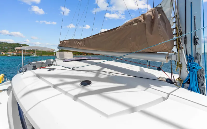 Endless Azul Yacht Photos Pics Fountaine Pajot Sanya 57 catamaran deck, 2013 model, with sails and ocean view.