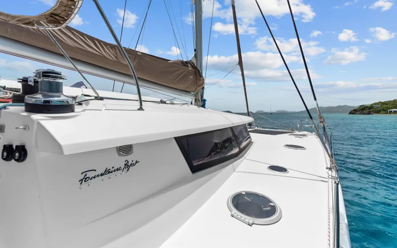 Endless Azul Yacht Photos Pics 2013 Fountaine Pajot Sanya 57 catamaran sailing on clear blue waters.