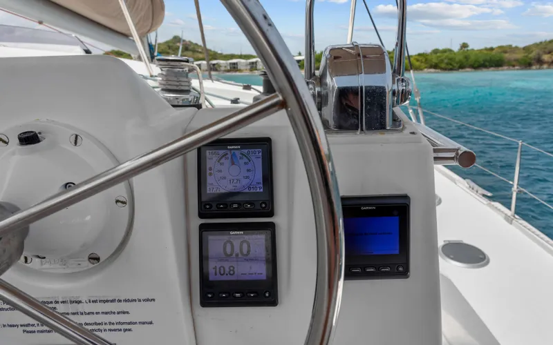 Endless Azul Yacht Photos Pics Helm of 2013 Fountaine Pajot Sanya 57 catamaran with navigation instruments, ocean view.