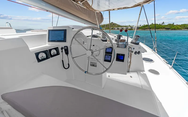 Endless Azul Yacht Photos Pics Helm of 2013 Fountaine Pajot Sanya 57 catamaran with ocean view and navigation instruments.