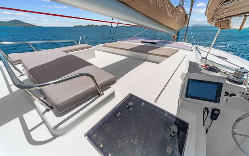 Endless Azul Yacht Photos Pics Luxurious deck of 2013 Fountaine Pajot Sanya 57 yacht with sun loungers and ocean view.