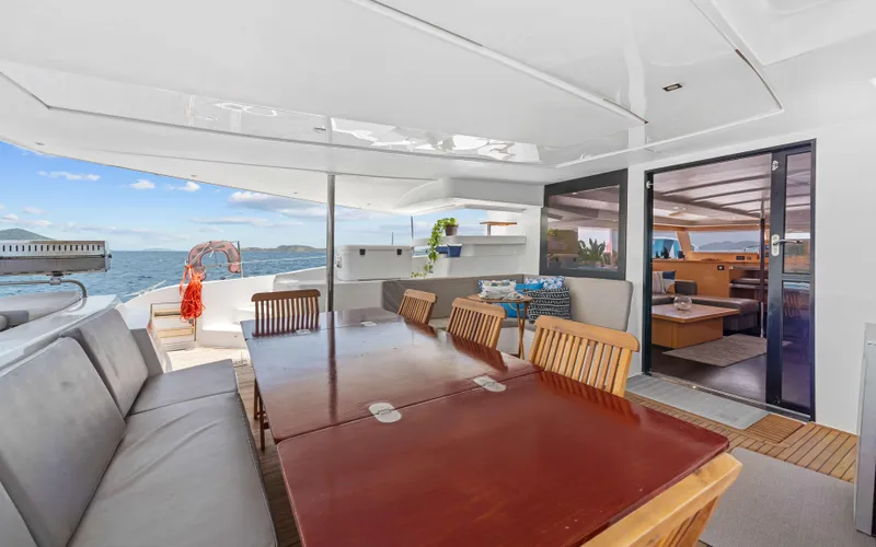 Endless Azul Yacht Photos Pics Luxurious 2013 Fountaine Pajot Sanya 57 yacht interior with dining area and ocean view.