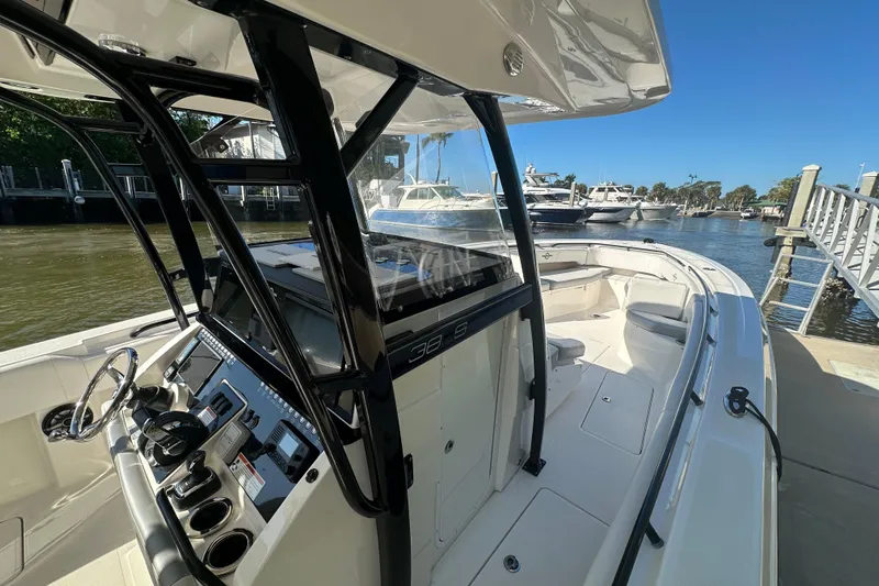  Yacht Photos Pics 2022 Fountain 38 CC LS boat docked, showcasing sleek design and modern controls.
