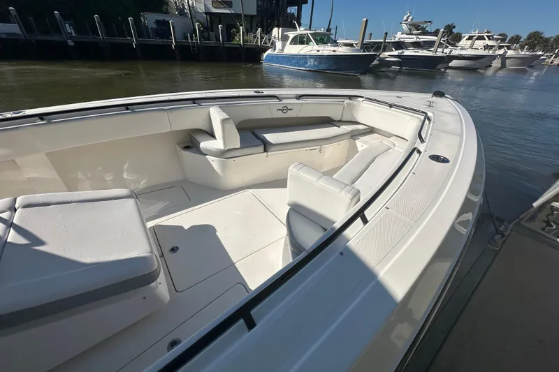  Yacht Photos Pics 2022 Fountain 38 CC LS boat with spacious seating at a marina.