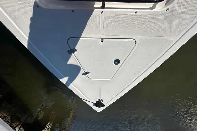  Yacht Photos Pics Bow of 2022 Fountain 38 CC LS boat, docked on calm water.