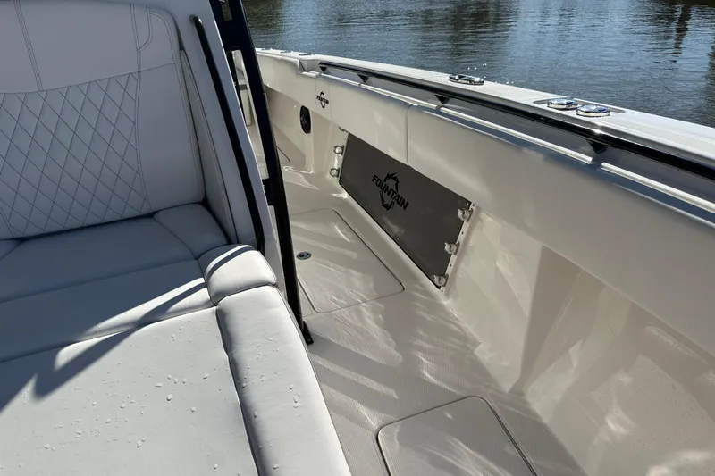  Yacht Photos Pics 2022 Fountain 38 CC LS boat interior with white seating and logo detail.