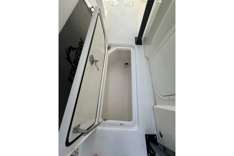  Yacht Photos Pics Open storage compartment on 2022 Fountain 38 CC LS boat deck.