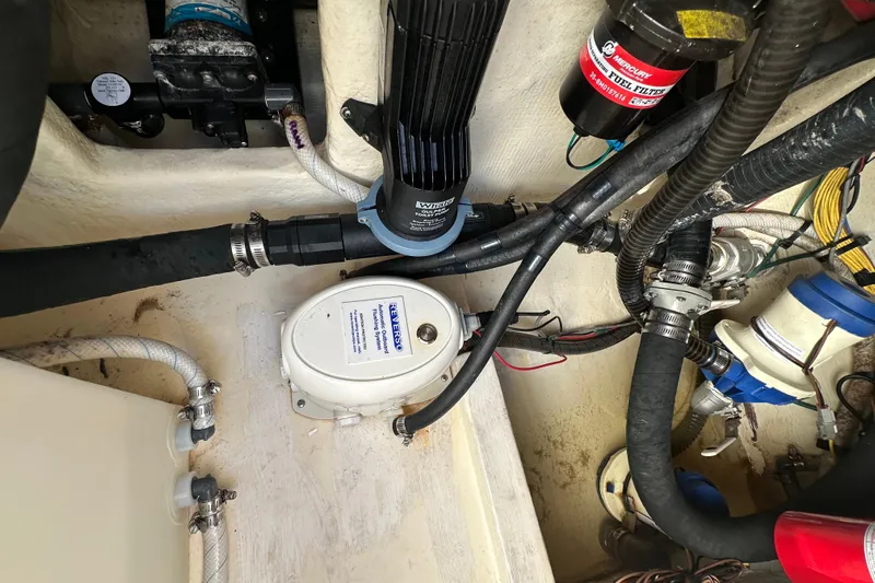  Yacht Photos Pics Engine compartment of 2022 Fountain 38 CC LS boat with various mechanical components.