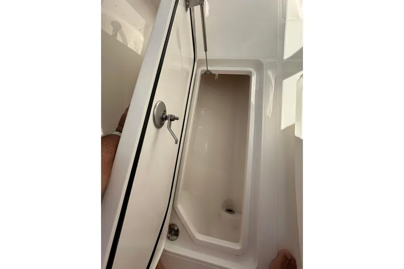  Yacht Photos Pics Interior view of 2022 Fountain 38 CC LS boat compartment with open hatch.
