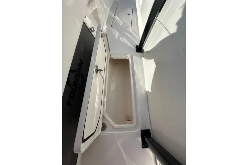  Yacht Photos Pics 2022 Fountain 38 CC LS boat storage compartment with open hatch.