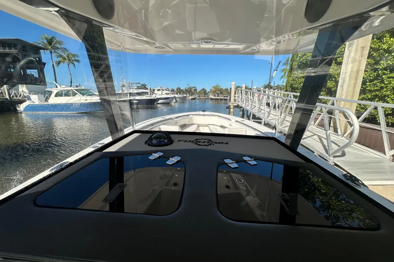  Yacht Photos Pics 2022 Fountain 38 CC LS boat docked at marina with clear blue sky.