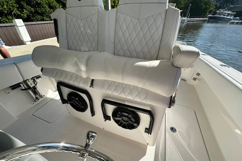  Yacht Photos Pics Luxury seating on 2022 Fountain 38 CC LS boat with diamond-stitched upholstery and integrated speakers.