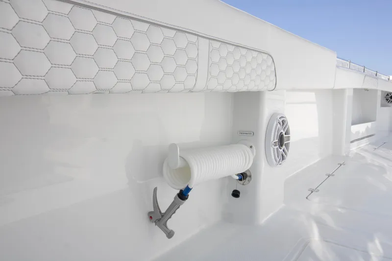  Yacht Photos Pics Invincible 36 Catamaran 2026 interior detail with speaker and hose storage.