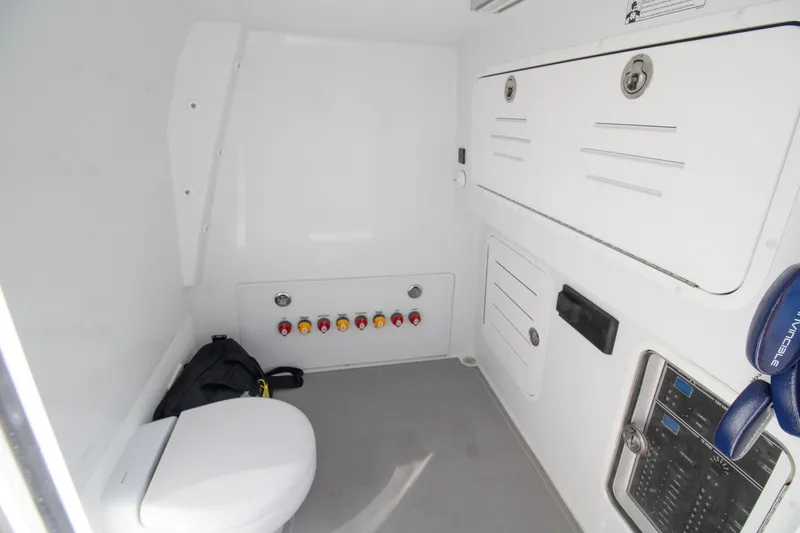  Yacht Photos Pics 2026 Invincible 36 Catamaran interior with toilet and control panel.
