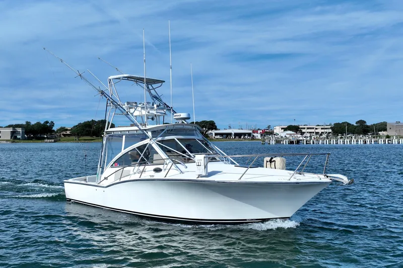 Barbara Ann Yacht Photos Pics 2001 Carolina Classic 35 Express boat cruising on a sunny day.
