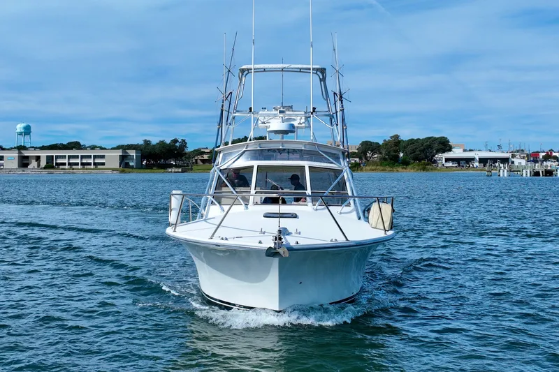 Barbara Ann Yacht Photos Pics 2001 Carolina Classic 35 Express boat cruising on a calm waterway.
