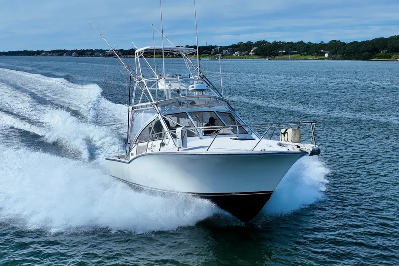 Barbara Ann Yacht Photos Pics 2001 Carolina Classic 35 Express boat cruising on open water.