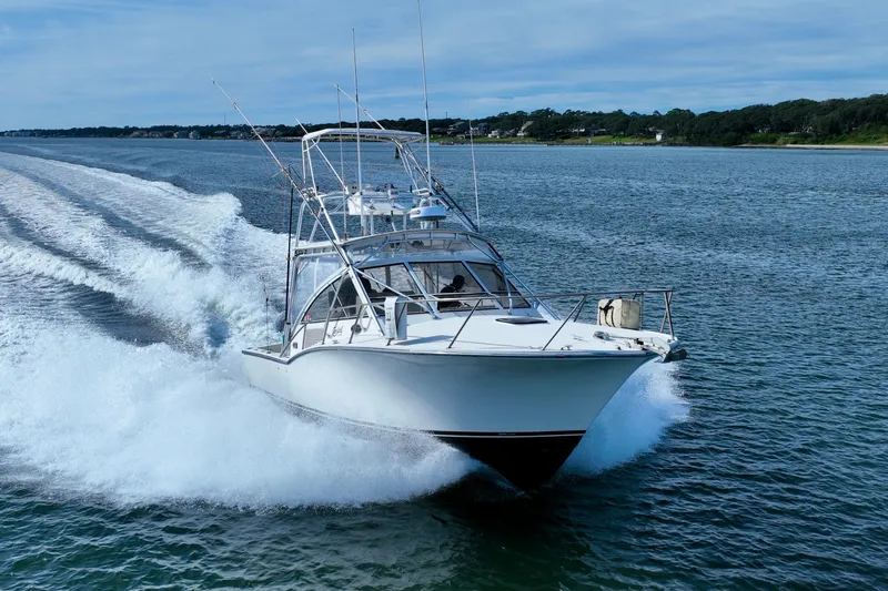 Barbara Ann Yacht Photos Pics 2001 Carolina Classic 35 Express cruising on open water, creating a dynamic wake.