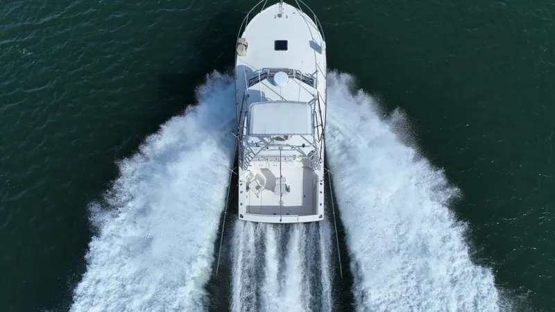 Barbara Ann Yacht Photos Pics Aerial view of 2001 Carolina Classic 35 Express boat cruising on water.