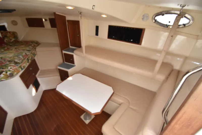 Barbara Ann Yacht Photos Pics 2001 Carolina Classic 35 Express cabin interior with seating, table, and bed.