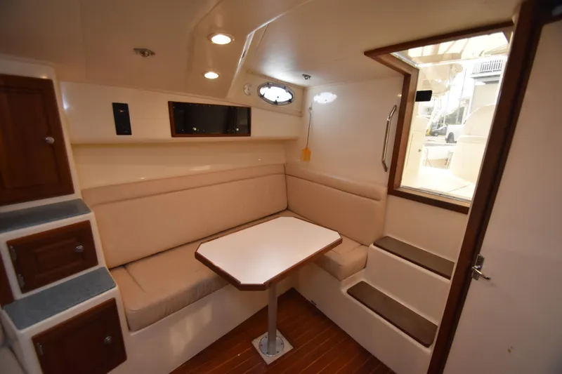 Barbara Ann Yacht Photos Pics Interior of 2001 Carolina Classic 35 Express with seating and table.
