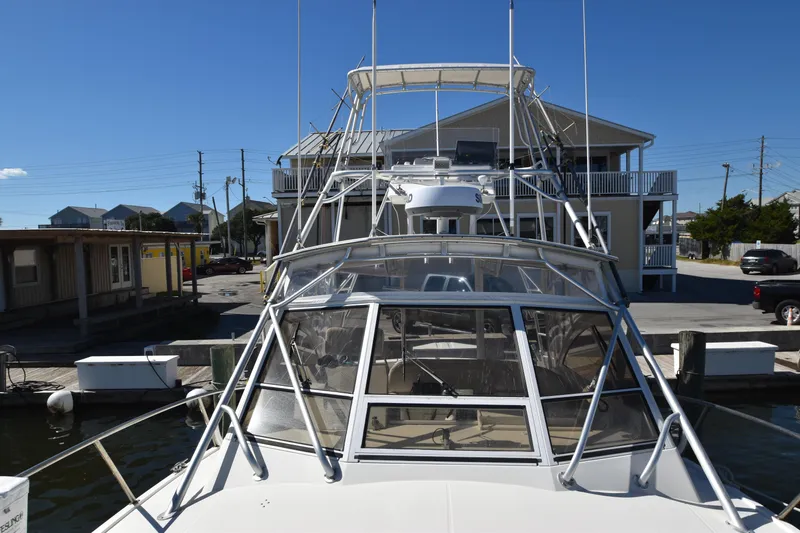 Barbara Ann Yacht Photos Pics 2001 Carolina Classic 35 Express boat docked at marina under clear blue sky.