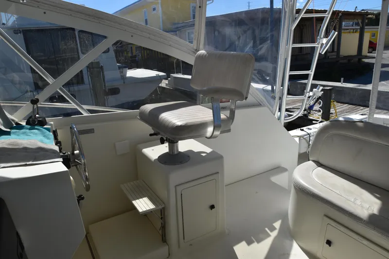 Barbara Ann Yacht Photos Pics Interior of 2001 Carolina Classic 35 Express boat with helm seat and controls.