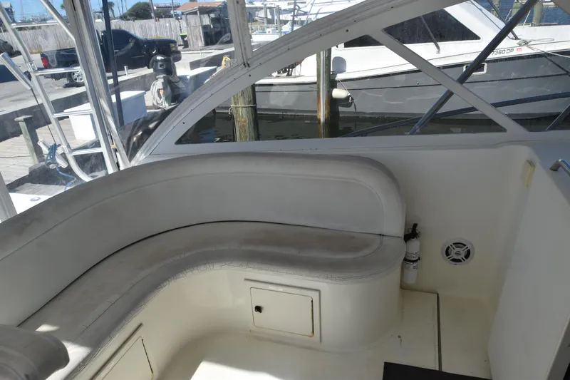 Barbara Ann Yacht Photos Pics 2001 Carolina Classic 35 Express boat interior with curved seating and dock view.