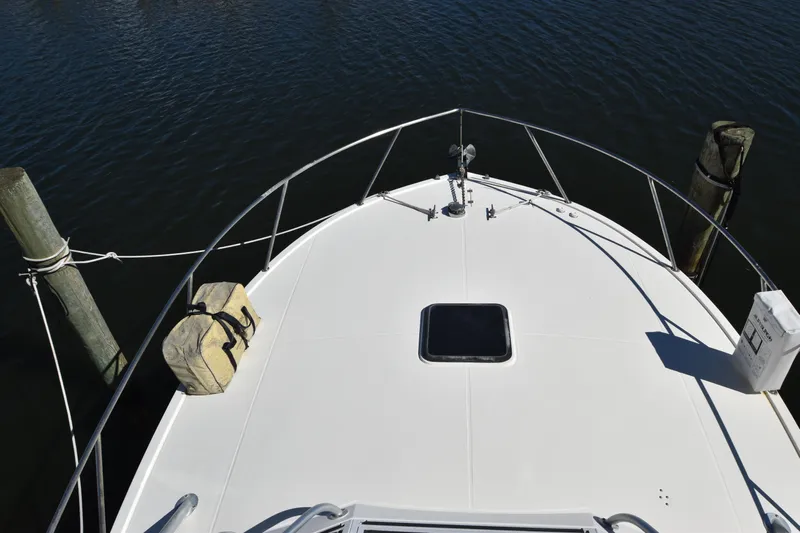Barbara Ann Yacht Photos Pics Bow view of 2001 Carolina Classic 35 Express boat docked on calm water.