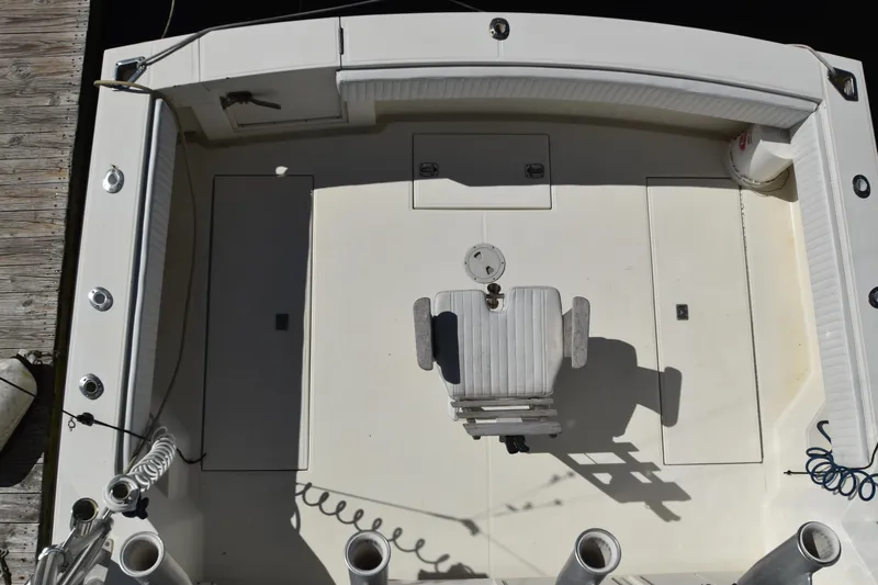 Barbara Ann Yacht Photos Pics 2001 Carolina Classic 35 Express boat deck with central chair and rod holders.