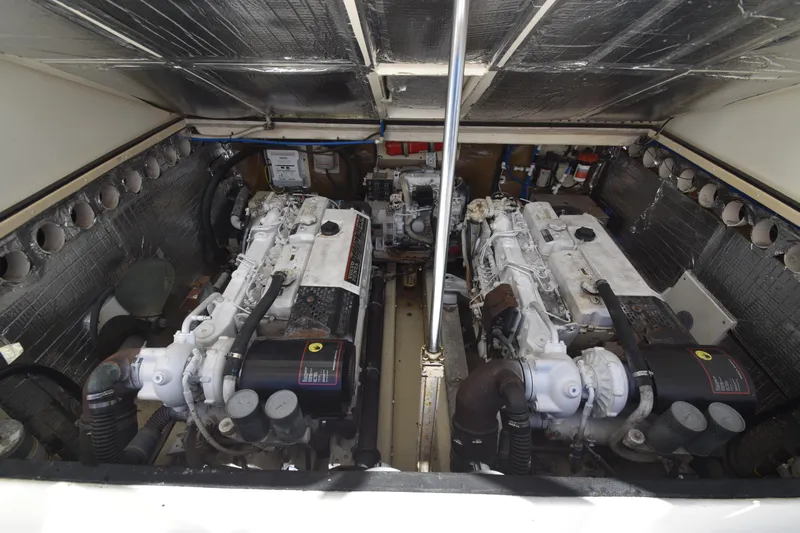 Barbara Ann Yacht Photos Pics Engine room of a 2001 Carolina Classic 35 Express boat, featuring dual engines.