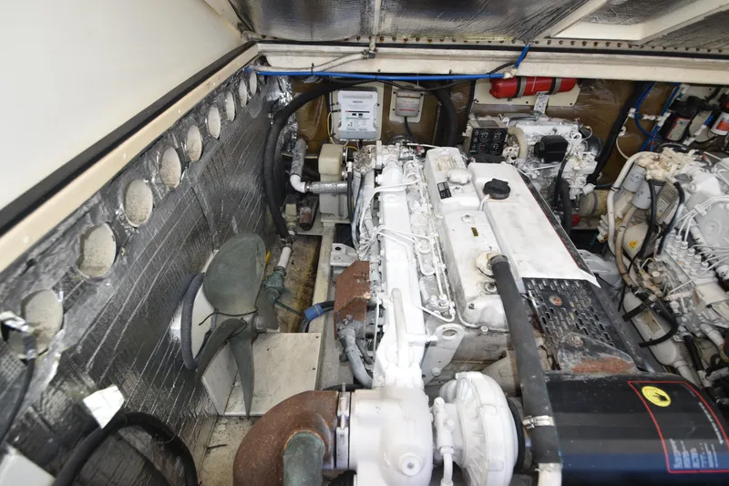 Barbara Ann Yacht Photos Pics Engine room of a 2001 Carolina Classic 35 Express boat, showcasing machinery and components.