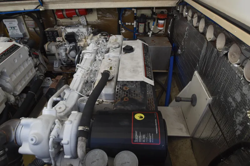 Barbara Ann Yacht Photos Pics Engine room of a 2001 Carolina Classic 35 Express boat, showcasing mechanical components.