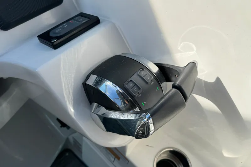  Yacht Photos Pics Throttle control of a 2020 Rinker 320 EX boat, featuring modern design and functionality.