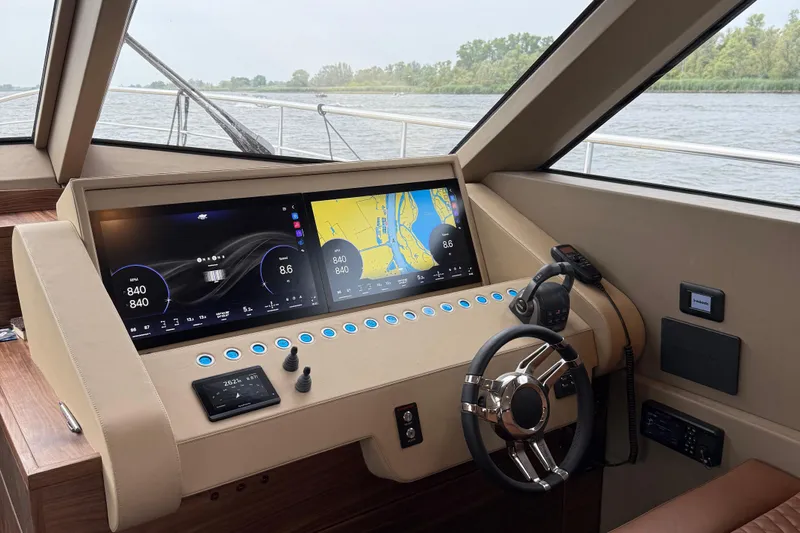  Yacht Photos Pics Helm of 2025 Van der Heijden 65 Exclusive de Luxe Flybridge with modern navigation displays.