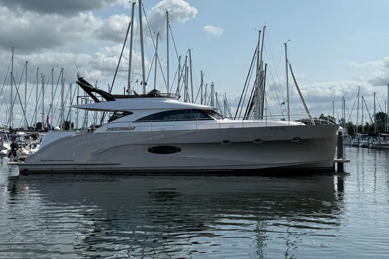  Yacht Photos Pics Luxury 2025 Van der Heijden 65 Exclusive de Luxe Flybridge yacht docked in marina.