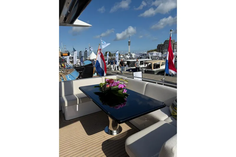  Yacht Photos Pics Luxurious Van der Heijden Exclusive Deluxe 2000 Sportbridge yacht interior with elegant seating and table.