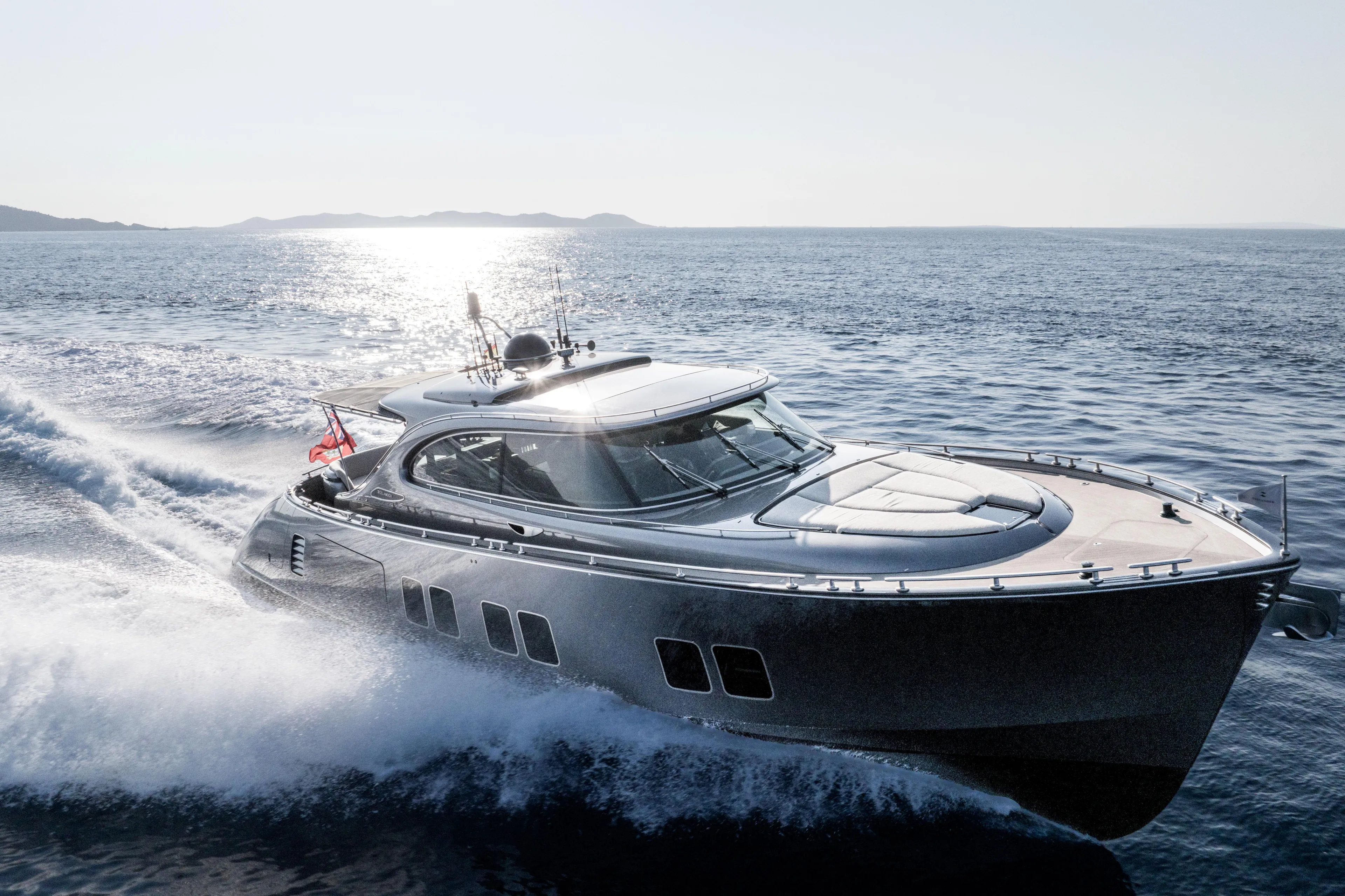 Loloma Yacht Photos Pics Luxurious 2025 Zeelander 7 yacht cruising on open sea under bright sunlight.