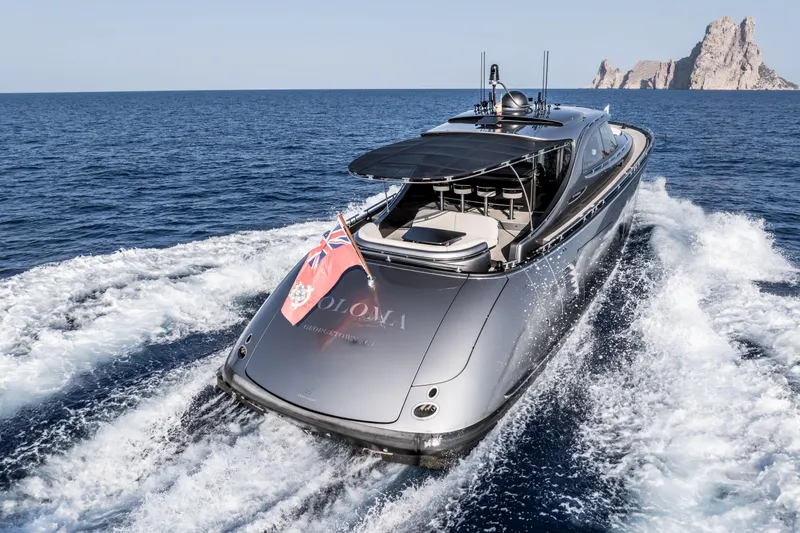 Loloma Yacht Photos Pics Luxury 2025 Zeelander 7 yacht cruising on open sea with scenic island backdrop.