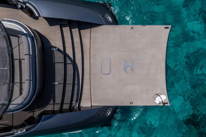 Loloma Yacht Photos Pics Top view of 2025 Zeelander 7 yacht on clear turquoise water.